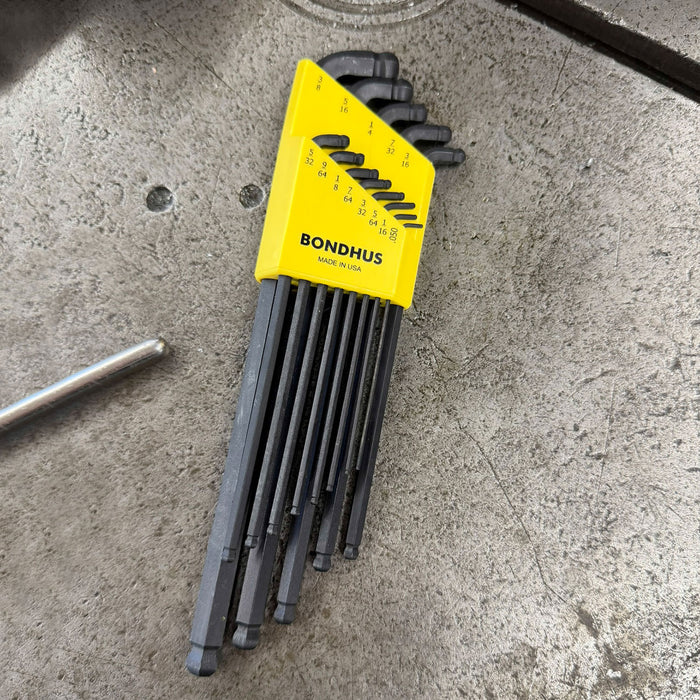 Set of hex keys with a yellow case on a concrete surface, featuring the Bondhus brand.
