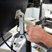 Silver Hex Ky being used to tighten the fixing on the back of a computer monitor