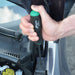 Hand using a torx screwdriver to work on a car engine