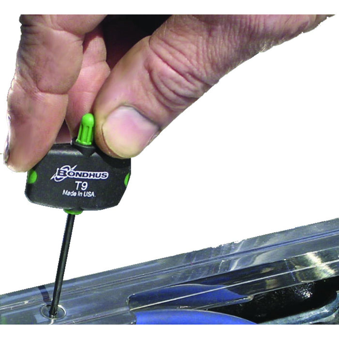 Hand using a Bondhus T9 screwdriver on a clear plastic surface