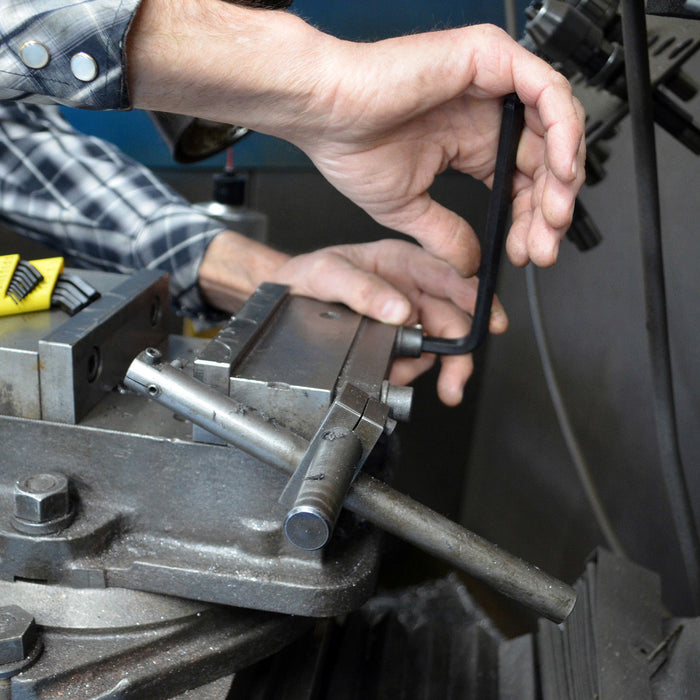 Person working with tools in a workshop setting