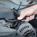 Person working on a car engine with a tool