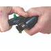 Hand holding a tool with a green knob on a white background